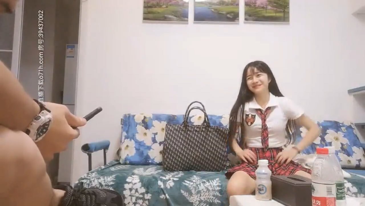 JK outfit with a small floral skirt, definitely a young girl, her breasts